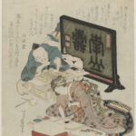 2 people working on a blockprint